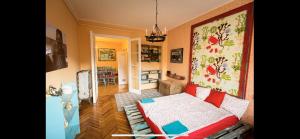 a bedroom with a bed and a living room at Best Location cosy Art flat in Budapest