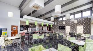 a rendering of a restaurant with tables and chairs at The Greens at Jackal Creek Golf Estate in Roodepoort