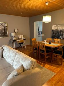 a living room with a couch and a table at Harmonia in Keminmaa