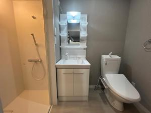 a bathroom with a toilet and a sink at ステイインアット勝富 in Sasebo +39 photos