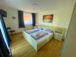 Postel nebo postele na pokoji v ubytování Ferienhaus Bibertal Anhofen