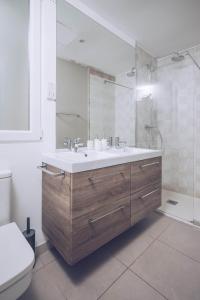 a bathroom with a sink and a shower and a toilet at Eclectic 2BR with shared terrace perfect getaway in Gibraltar