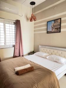 Ένα ή περισσότερα κρεβάτια σε δωμάτιο στο Yana 3Bhk Apartment WiFi AC Smart Tv Kitchen