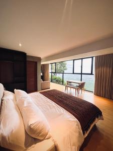 Giường trong phòng chung tại Busay Getaway +22 ảnh