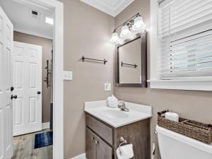 a bathroom with a sink and a mirror at Beachside Villas 122- Sun for the Roses in Santa Rosa Beach +31 photos