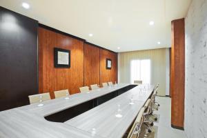 a large conference room with a long table and chairs at Hotel Donia Sfax in Sfax