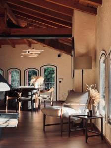 a living room with a piano and a table at Paraje de Montaña de Ensueño en el Corazón de Camprodon in Camprodon