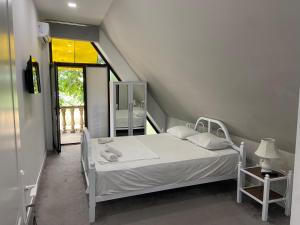 a white bed in a room with a window at Viva hotel Gabala with outdoor pool ,Sauna and Waterfall in Gabala +86 photos