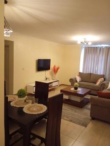 TV a/nebo společenská místnost v ubytování Caykal luxury homes