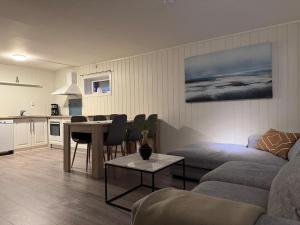 a living room with a couch and a table at Apartment in Tromsø in Tromsø