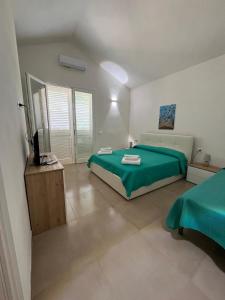 Postel nebo postele na pokoji v ubytování La casetta della Pigna Verde