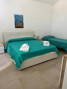 Postel nebo postele na pokoji v ubytování La casetta della Pigna Verde + 27 fotografií