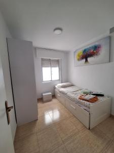 Ένα ή περισσότερα κρεβάτια σε δωμάτιο στο Apartamento Alfonso Barbate