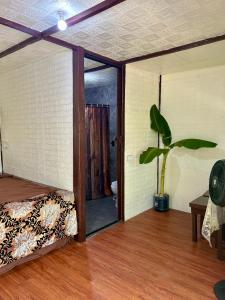 a room with a bed and a bathroom with a shower at Sobral Rice Terraces View in Antihon +65 photos