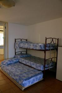 Ένα ή περισσότερα κρεβάτια σε δωμάτιο στο Casa delle Onde