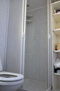 a bathroom with a toilet and a shower at Casa delle Onde in San Vito +23 photos