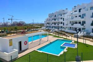 an image of a swimming pool in front of a building at Casa Emerald by Rental Hero in Torre-Pacheco
