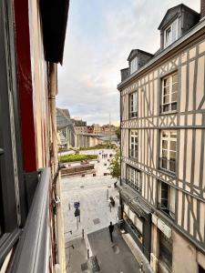 a view of a street from a window of a building at Cocon Zen en plein Cœur historique de Rouen in Rouen