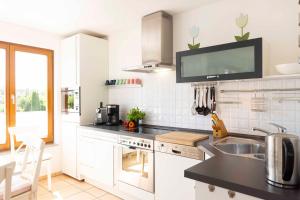Η κουζίνα ή μικρή κουζίνα στο PAM4 Ferienwohnung Leffler +9 φωτογραφίες
