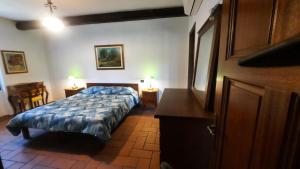 Postel nebo postele na pokoji v ubytování Agriturismo Fornace Certosa