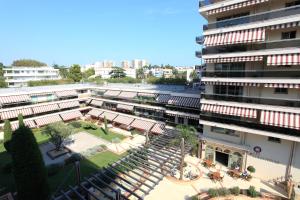an overhead view of a building with a courtyard at The Originals Boutique, Hôtel Les Strélitzias in Juan-les-Pins