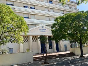 a white building with trees in front of it at Apartamento lux capilla in Seville