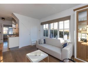 a living room with a couch and a table at Apartment in Zoutelande near the Beach in Zoutelande