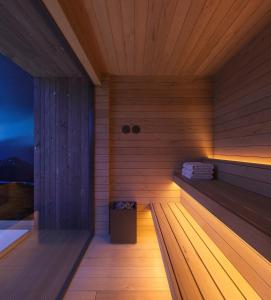 a room with a sauna with a box in it at Secluded Lodge - Stunning Views! in Storøya