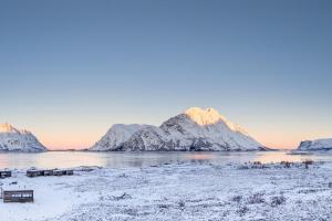 a view of the water with mountains in the background at Secluded Lodge - Stunning Views! in Storøya