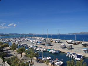 a marina filled with lots of boats in the water at Harborfront Escape in Mallorca in Can Picafort