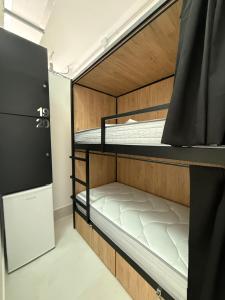 Ένα ή περισσότερα κρεβάτια σε δωμάτιο στο Hostel La Camella