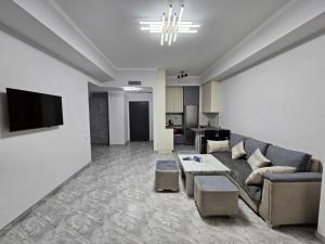 a living room with a couch and a table at New Alvina 44 in Tsaghkadzor