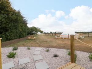a group of tents and tables in a field at Bell 1 in Cirencester +8 photos