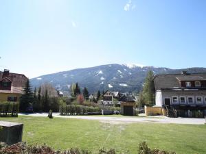 a view of a town with a mountain in the background at Apartment in Sankt Michael near Ski Slopes in Sankt Michael im Lungau +16 photos