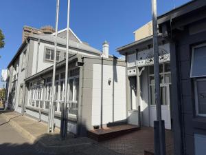 a white building on the side of a street at Sapphire Hotel in Bloemfontein