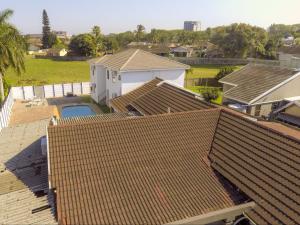 an aerial view of roofs of houses at Jnc Lodge in Richards Bay