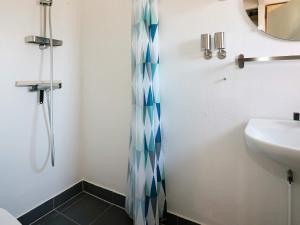 a bathroom with a shower and a sink at 6 person holiday home in Hadsund in Hadsund