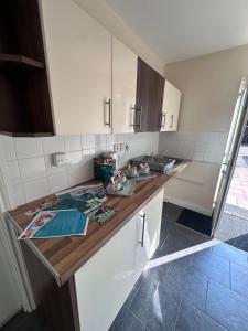a kitchen with a wooden counter top in a room at Minworth Lodge in Minworth
