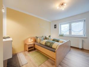 Ένα ή περισσότερα κρεβάτια σε δωμάτιο στο Ferienhaus in Wiesing nahe Skipisten