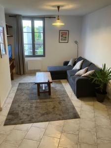 O zonă de relaxare la Grand appartement centre ville château St Pierre