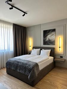 Postel nebo postele na pokoji v ubytování DOM Boutique Apartments AURORA + 61 fotografií