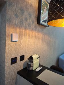 a coffee maker on a counter in a room at Magic Spa Apartman in Sremska Mitrovica