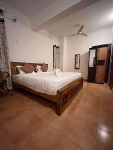 a bedroom with a large bed in a room at L'EDELWEISS Heritage House in Puducherry