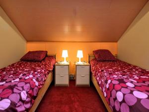 two beds sitting next to each other in a room at Peaceful Escape, Malmedy in Malmedy