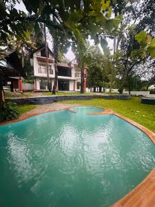 a large pool of water in front of a house at Vista valley in Kattappana