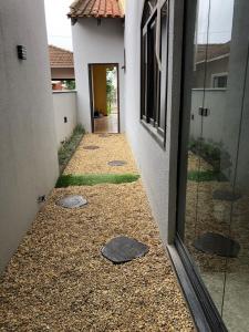 an alley between two buildings with a door and a room at Boa Vista Apartment in Joinville +56 photos