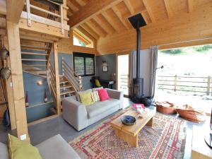 a living room with a couch and a table at Chalet in La Tzoumaz near Ski Slopes in Riddes +32 photos