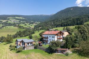 an aerial view of a house on a hill at Linderhof in Bressanone