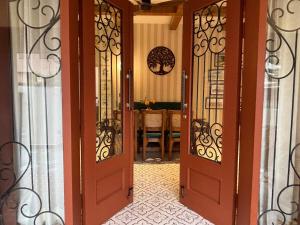 an open door to a room with a table at Prantara in Dehradun +25 photos