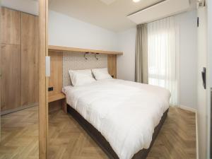 Ένα ή περισσότερα κρεβάτια σε δωμάτιο στο Moezel Lodge - Tranquil Getaway for 4